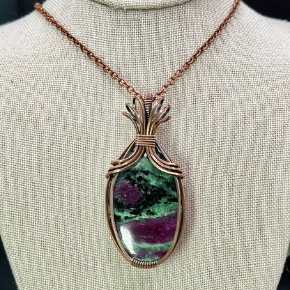 Oval Ruby Zoisite stone wrapped in copper