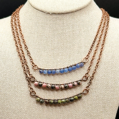 Bar necklace options of rhodonite, dragons blood, and blue aventurine
