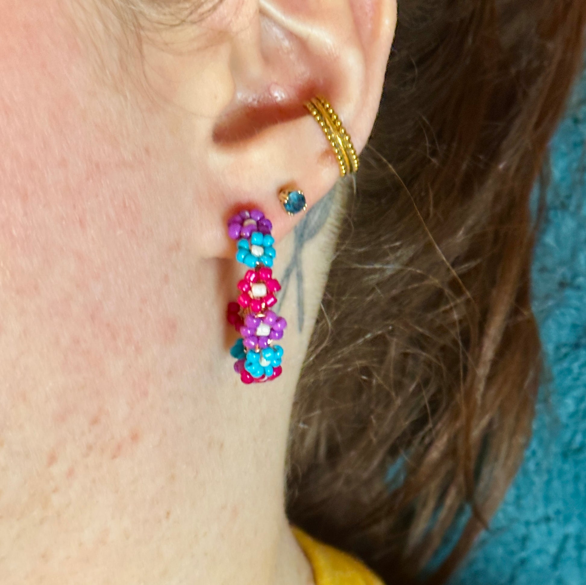 photo showing the flower bead hoop earrings being worn from the front