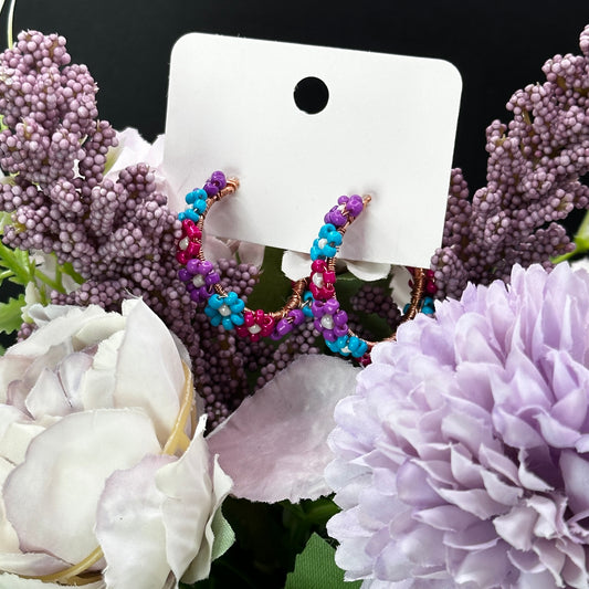 Flower Bead hoop earrings in purple, teal, and dark pink flower designs