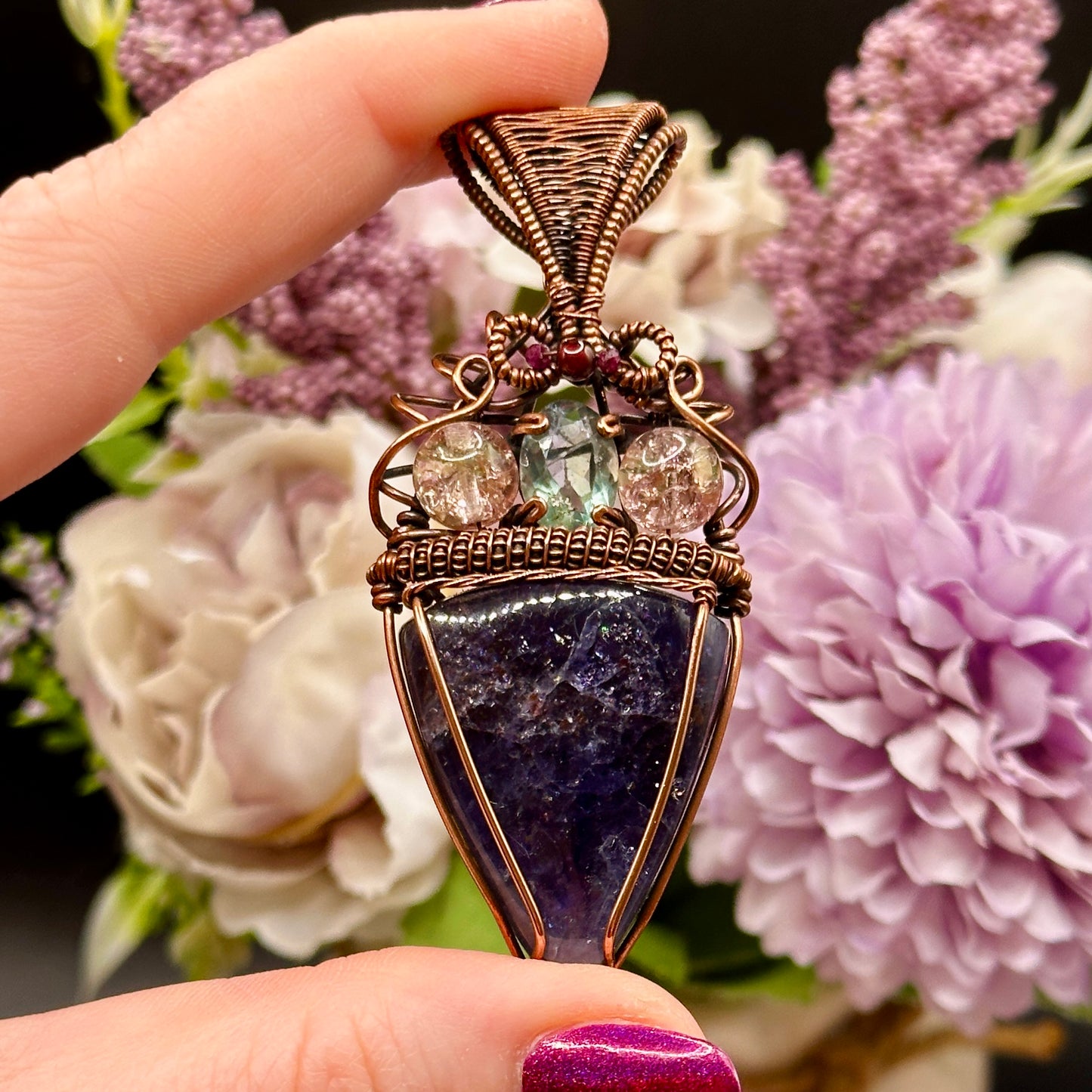 An Iolite Sunstone wrapped in antiuqed copper with 2 Uranium Glass Beads & Fluorite Facet