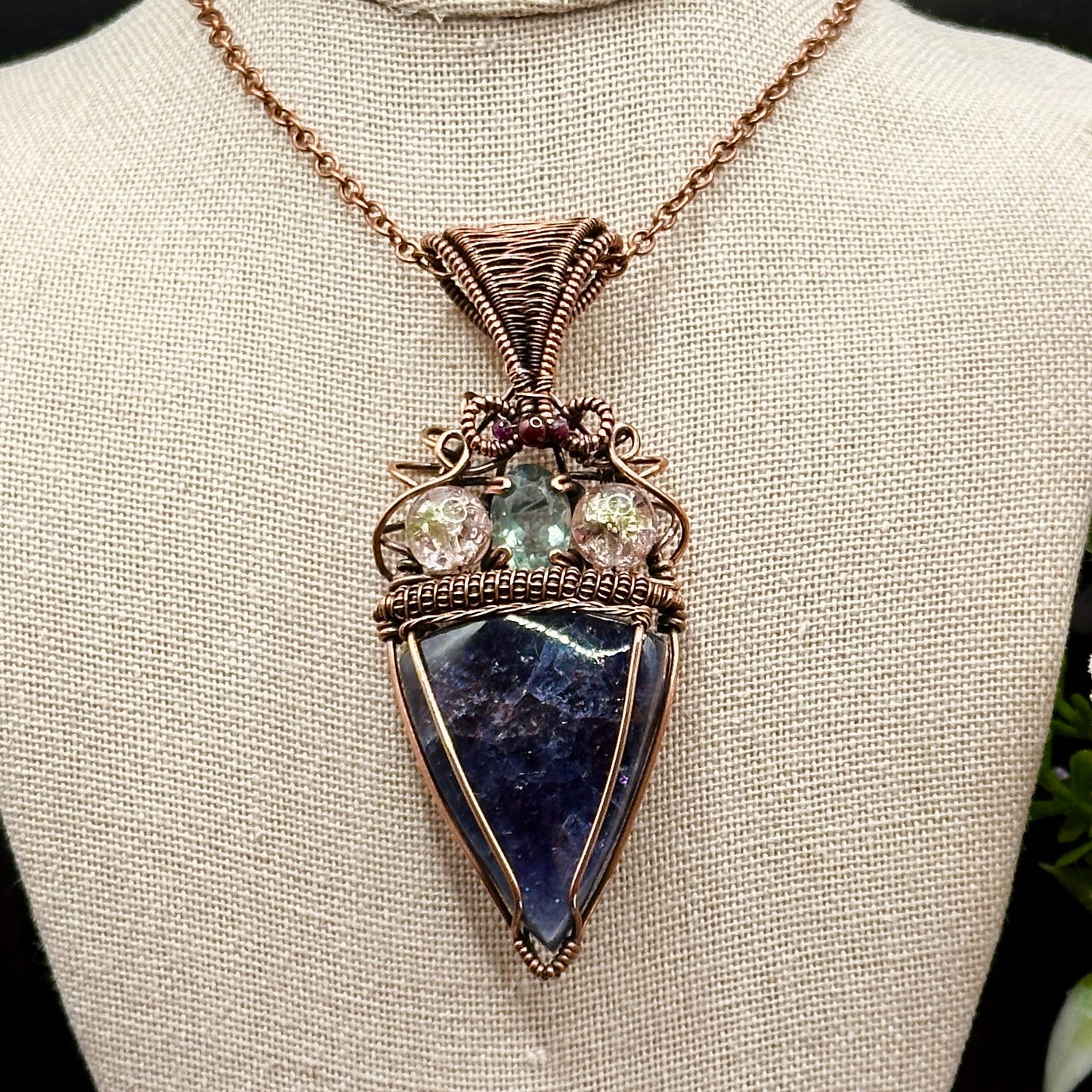 An Iolite Sunstone wrapped in antiuqed copper with 2 Uranium Glass Beads & Fluorite Facet