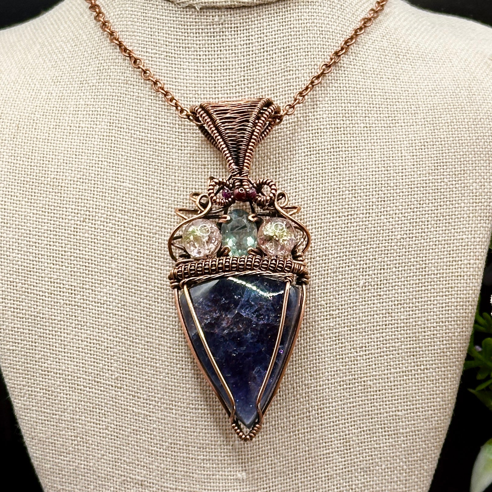 An Iolite Sunstone wrapped in antiuqed copper with 2 Uranium Glass Beads & Fluorite Facet