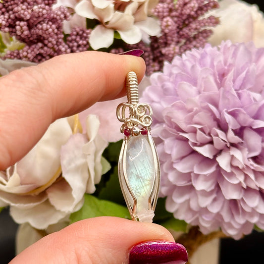 Marquis moonstone with garnet and silver beads and a rose quartz star, wrapped in silver plated copper wire
