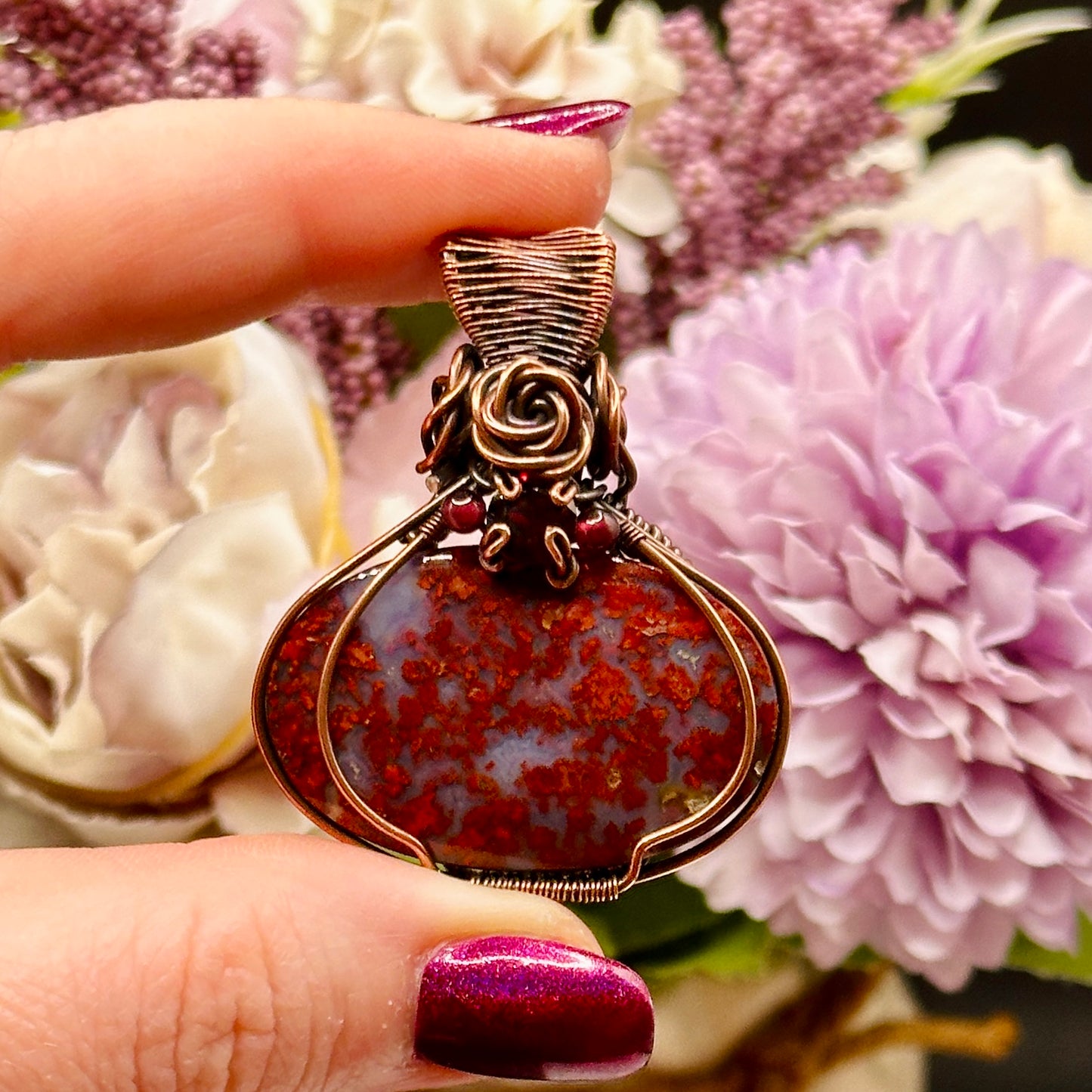 red plume moss agate stone wrapped in antiqued copper with rose and garnet accents 