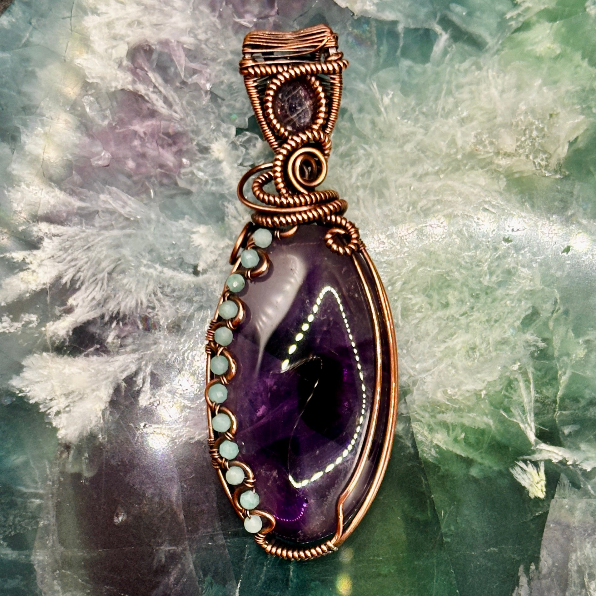 Trapiche Amethyst wrapped in antiqued copper w/ Amazonite beads & an Iolite Sunstone facet