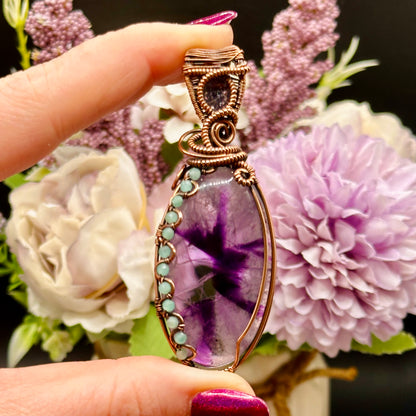 Trapiche Amethyst wrapped in antiqued copper w/ Amazonite beads & an Iolite Sunstone facet
