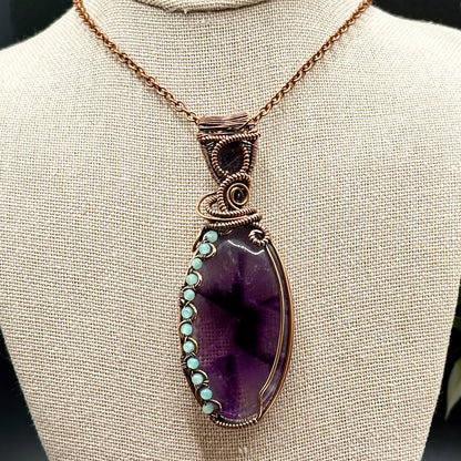 Trapiche Amethyst wrapped in antiqued copper w/ Amazonite beads & an Iolite Sunstone facet