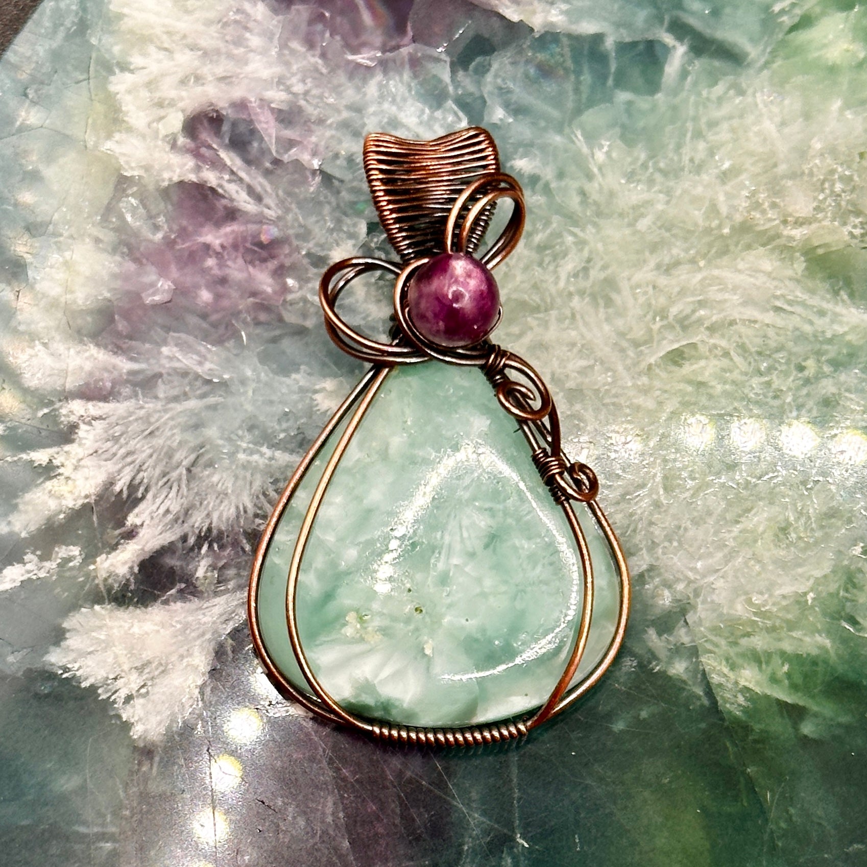 Victoria Stone wrapped in antiqued copper with purple mica bead
