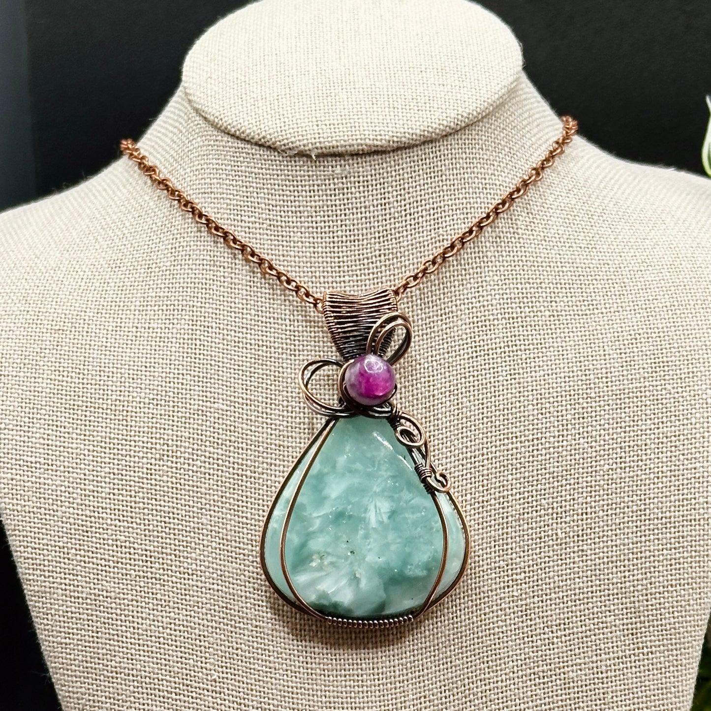 Victoria Stone wrapped in antiqued copper with purple mica bead