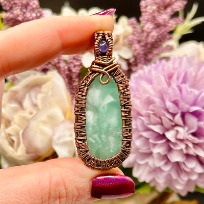 victoria stone with intricately woven antiqued copper frame accented with tanzanite facet