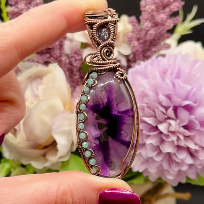 Video to show flash on the stone facet in the Trapiche Amethyst wrapped in antiqued copper w/ Amazonite beads & an Iolite Sunstone facet